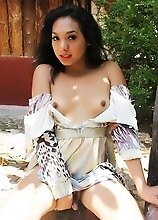 Petite girl flashing outdoors